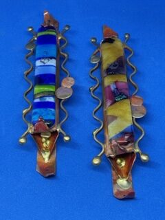 Fused glass and brass rods 7½ inches long. Colors: Blue and Yellow. RC16 $90 each.